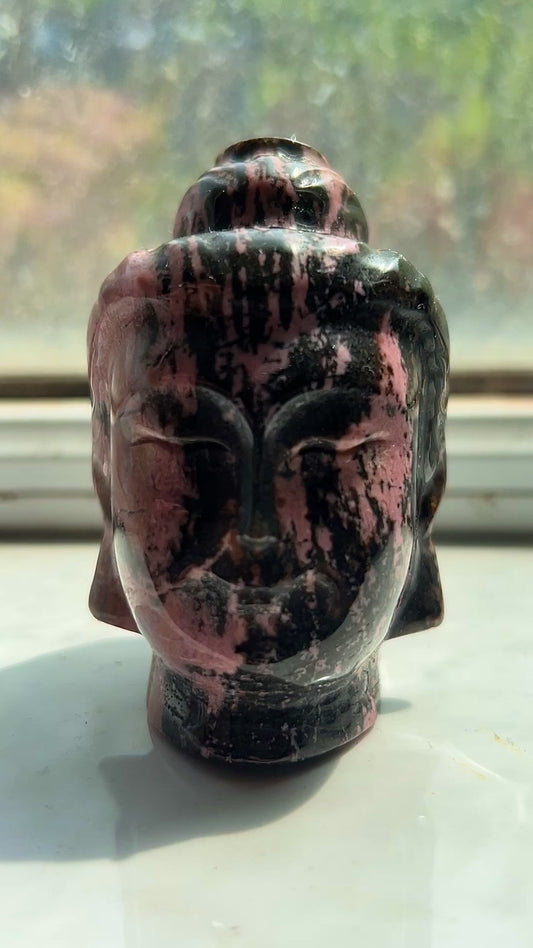 Rhodonite buddha head